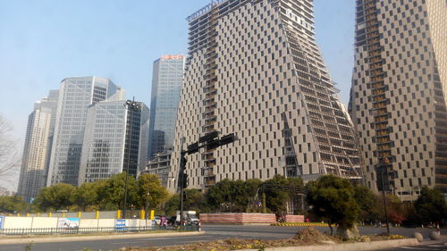 Modern buildings in city against sky