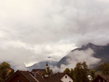 Houses and buildings against sky