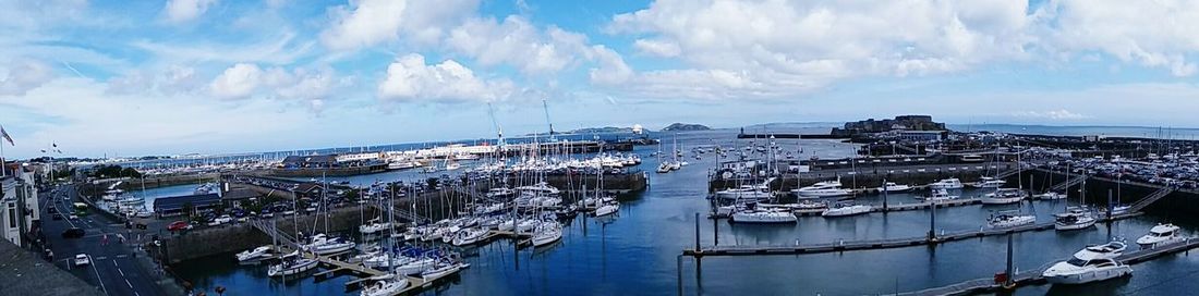 Panoramic view of boats moored at harbor