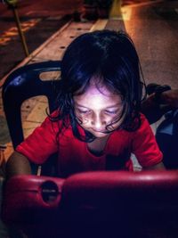 Portrait of girl sitting in car