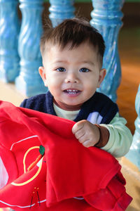 Portrait of a happy little boy 1-year-old at home in winter. happy baby toddler face 