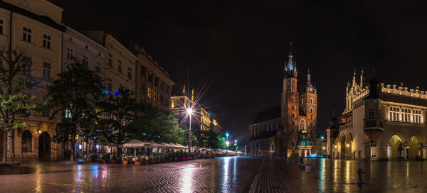 Illuminated city buildings at night