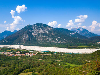 Scenic view of landscape and mountains against sky