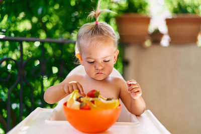 Midsection of girl holding ice cream