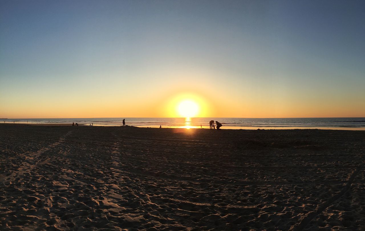 beach, sea, sunset, sand, nature, sun, horizon over water, beauty in nature, scenics, shore, tranquil scene, water, tranquility, sunlight, sky, silhouette, idyllic, outdoors, clear sky, summer, vacations, travel destinations, no people, day