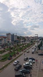 High angle view of city street and buildings against sky