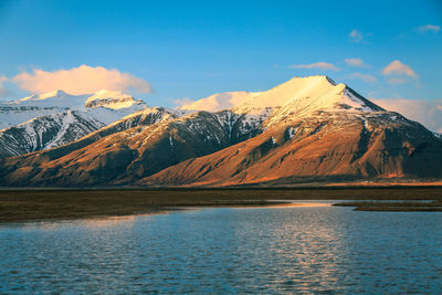 Scenic view of snowcapped mountain against sky