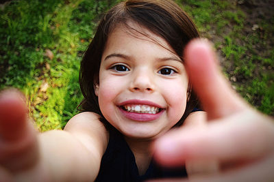 Portrait of happy smiling girl gesturing