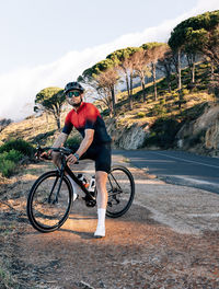 Man riding bicycle on road