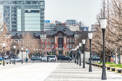 Street amidst buildings against sky in city