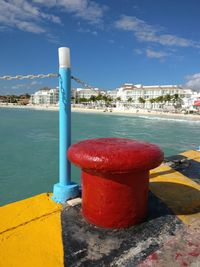 View of swimming pool by sea against sky