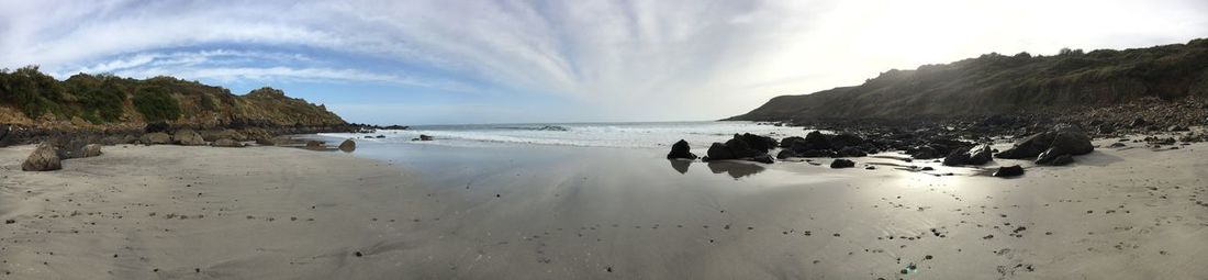 Panoramic view of beach against sky