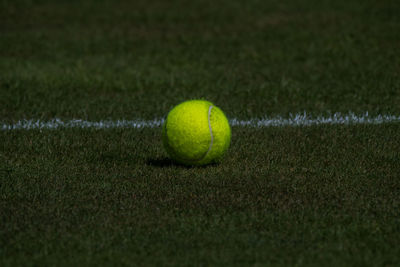 Close-up of yellow ball on grass