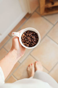 Low section of woman holding food