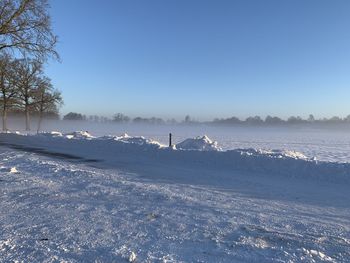 Scenic view of frozen sea against clear sky during winter