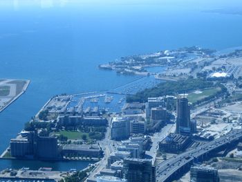 High angle view of cityscape against sea