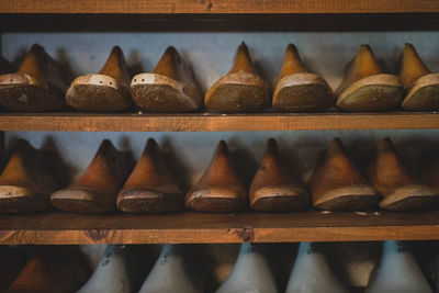 Close-up of wooden shoe mold on shelf