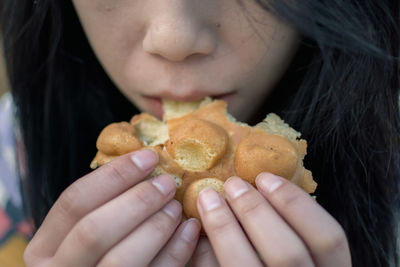 Close-up of woman eating food