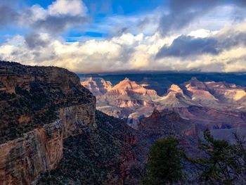 Scenic view of mountain against cloudy sky