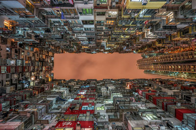 Directly below shot of illuminated residential buildings