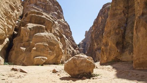 Rock formation on land against clear sky