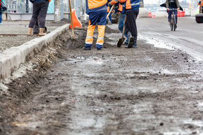 Low section of people working at construction site