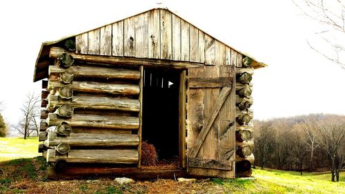 Old wooden structure on field