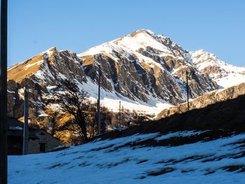 Snowcapped mountains against clear sky