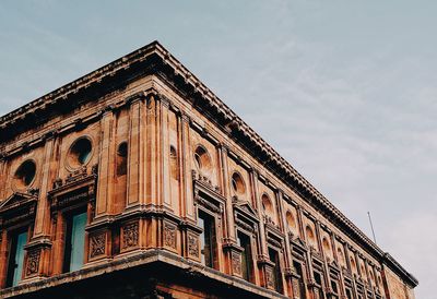 Low angle view of old building against sky