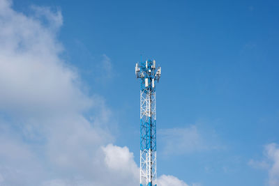 Low angle view of communications tower against sky