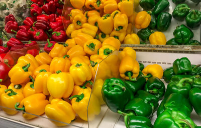 Yellow bell peppers for sale at market stall