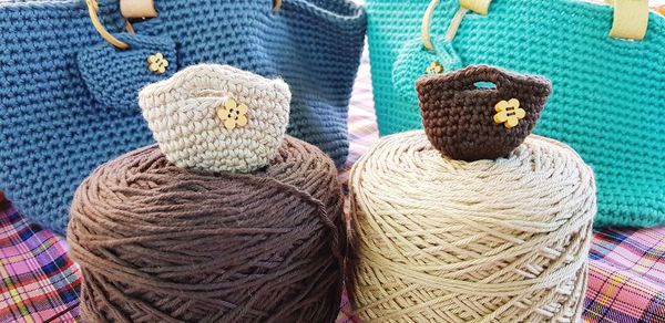 Close-up of wool purses and bags at market stall