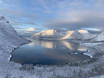 Scenic view of frozen lake against sky