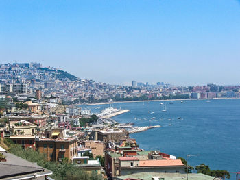 View of cityscape against blue sky