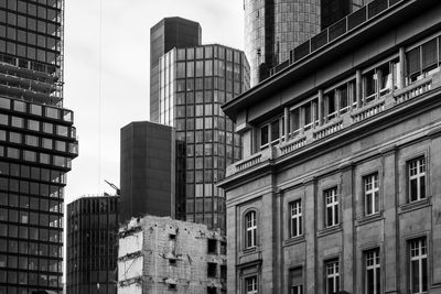 Low angle view of modern buildings in city against sky