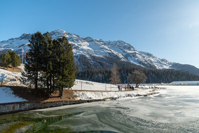 Saint moritz, switzerland, february 21, 2023 frozen lake of saint moritz and an alpine panorama 