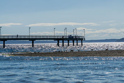 A silhouette shot of the pier in des moines, washington.