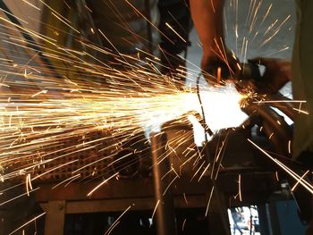 Man working on metal in factory