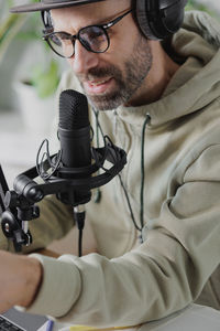 Portrait of man holding microphone