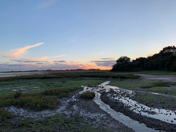 Scenic view of landscape against sky during sunset