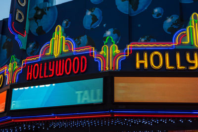 Low angle view of illuminated carousel at amusement park