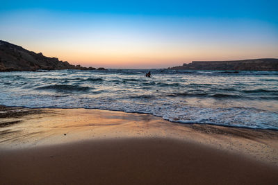 Scenic view of sea against sky during sunset