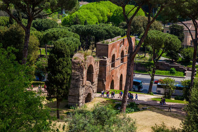 Tourists visiting the ruins of the aqua claudia in rome