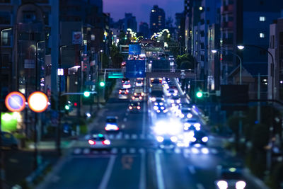 Illuminated city street at night