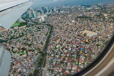 Aerial view of cityscape against sky