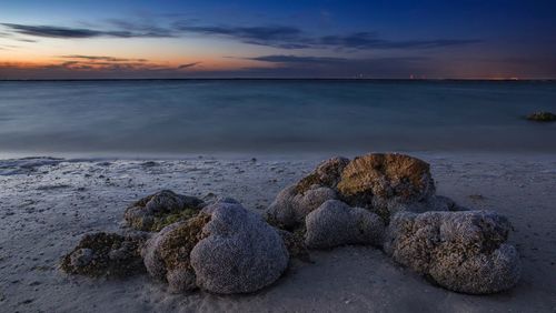 Scenic view of sea against sky at sunset