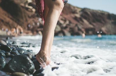 Low section of woman on beach