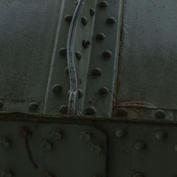 Close-up of rusty chain on wall