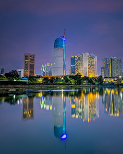 Reflection of illuminated buildings in water