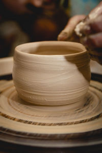 Close-up of hand holding cup